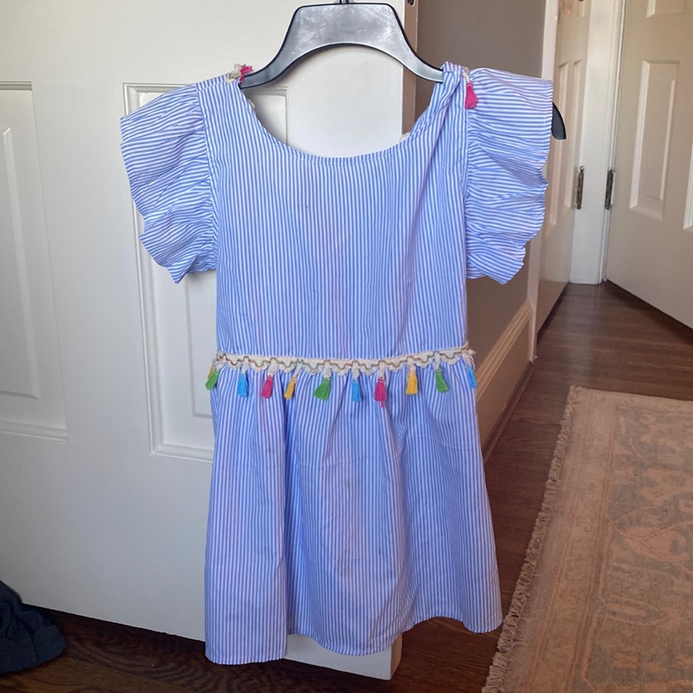 Striped top with tassels. Super cute!   Tie in the back